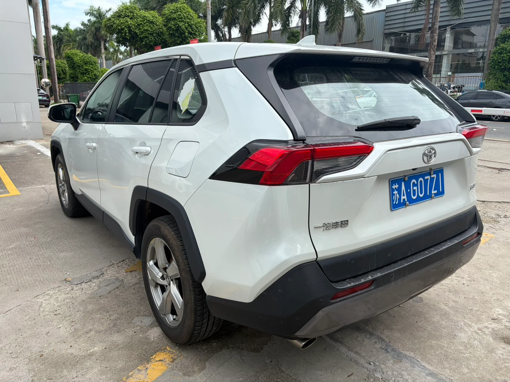 2023 Toyota RAV4 white rear three-quarter view
